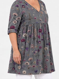 Addison long blouse side view on a plus-size model