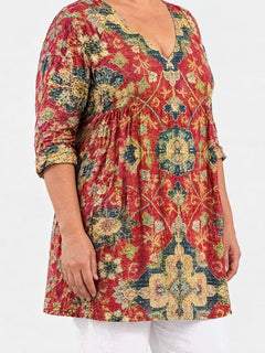 Amoura long blouse side view on a plus-size model