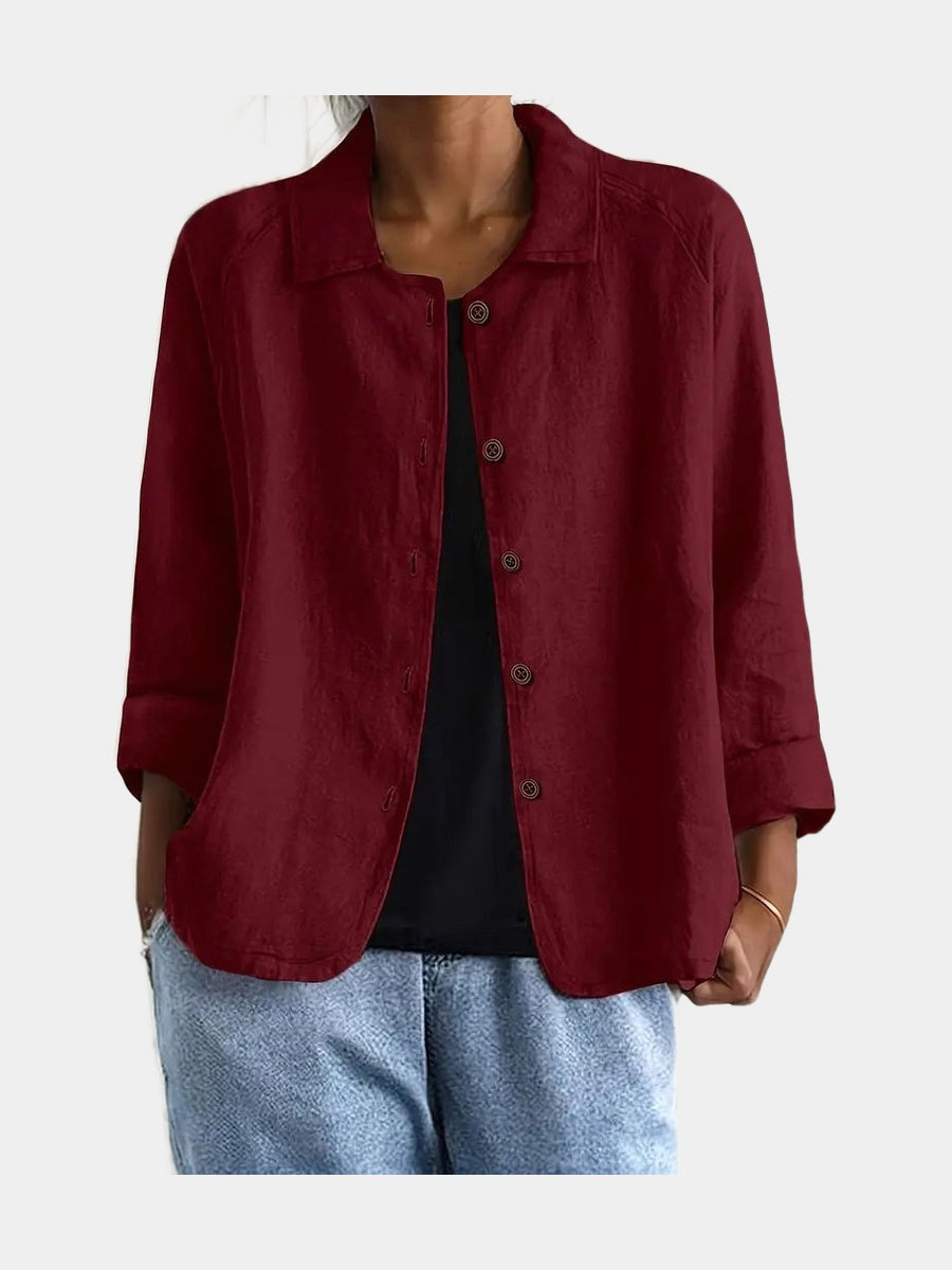 Open blouse in deep wine red with a matte crinkled weave, worn over a black top