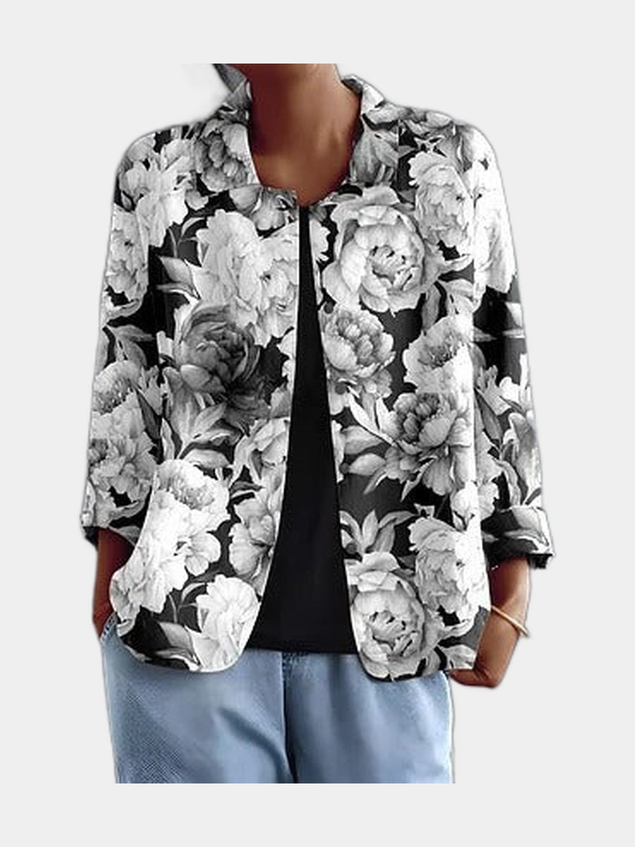 Open blouse with black and white engraved peonies, worn over a black top