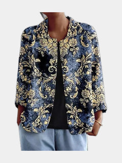 Open blouse with gold baroque scrollwork on deep indigo, worn over a black top