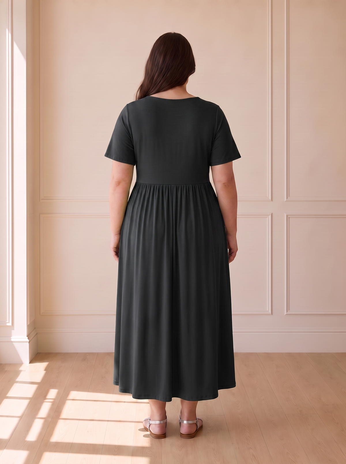Isadora A-line midi dress in black, back view
