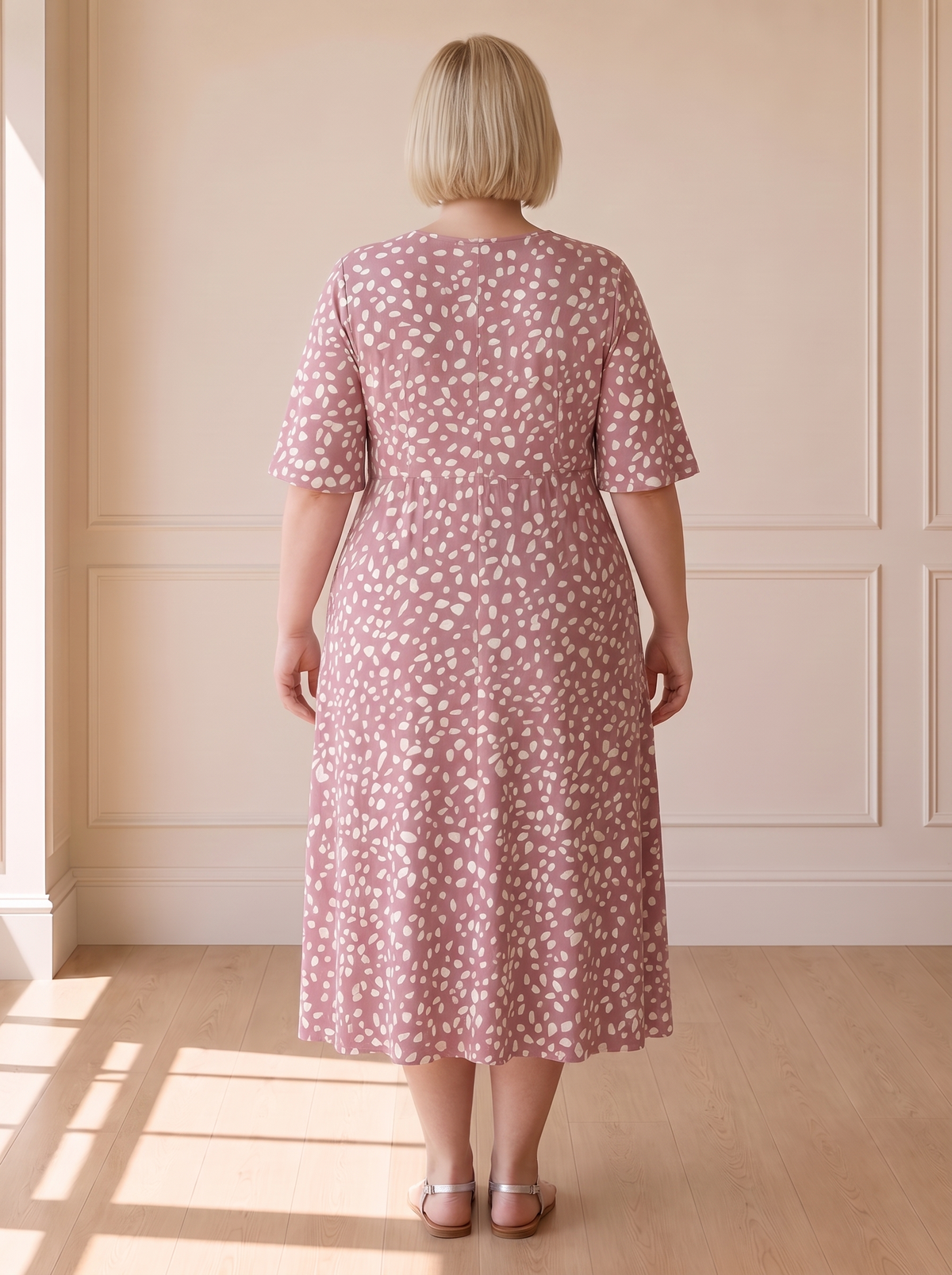 Colette polka dot midi dress in pink, back view