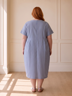 Susana striped cocoon midi dress in blue, back view, worn by a plus-size model