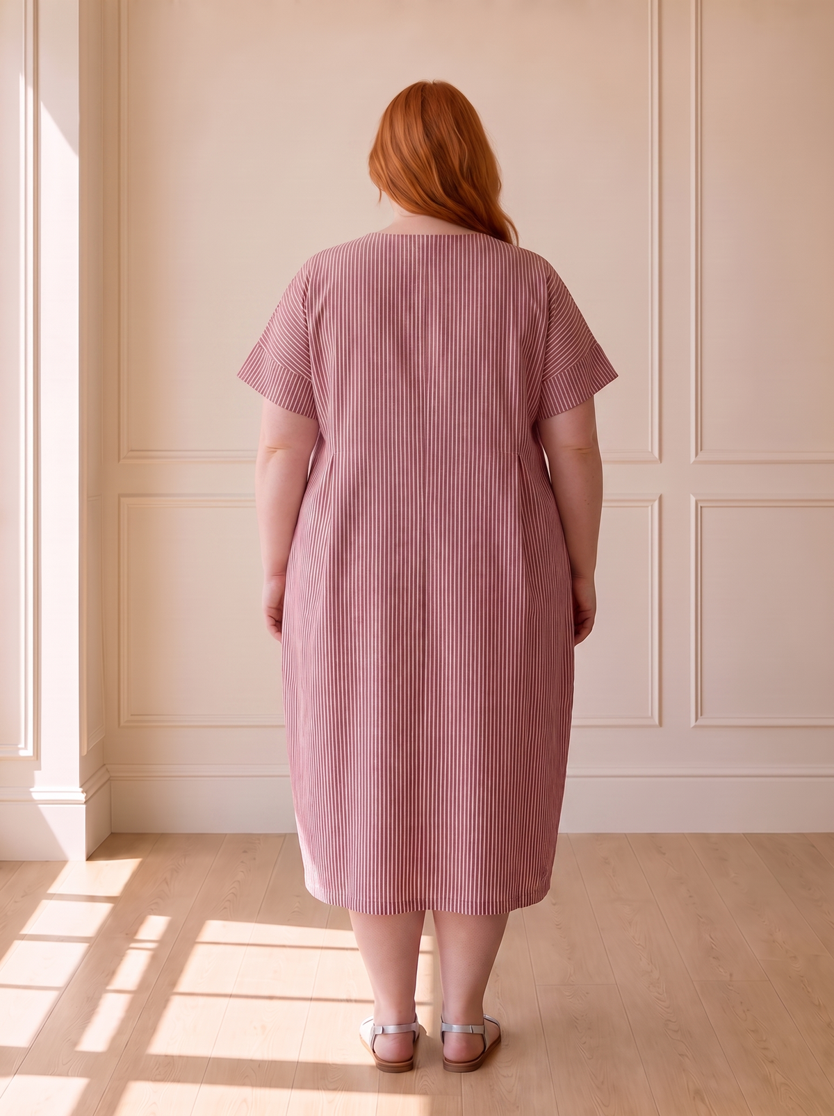 Susana striped cocoon midi dress in red, back view, worn by a plus-size model