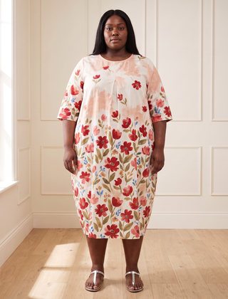 Leila floral cocoon midi dress in pink, front view, worn by a plus-size model