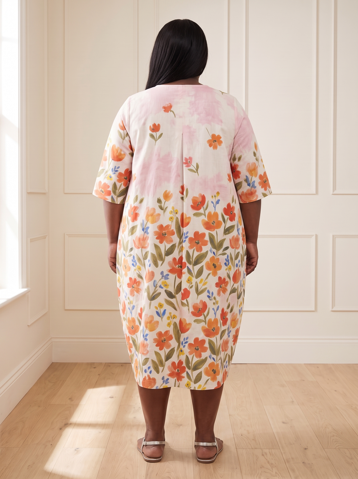 Leila floral cocoon midi dress in red, back view, worn by a plus-size model