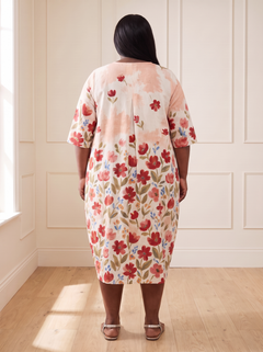 Leila floral cocoon midi dress in pink, back view, worn by a plus-size model