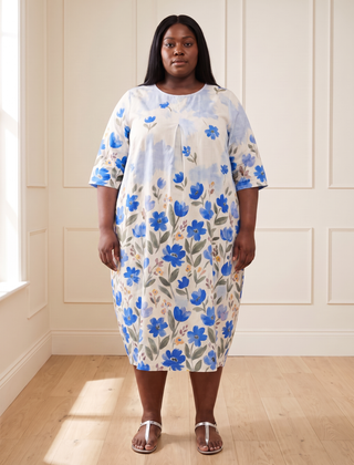 Leila floral cocoon midi dress in blue, front view, worn by a plus-size model