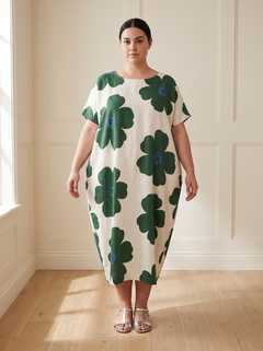 Lilia floral cocoon midi dress in green, front view, worn by a plus-size model