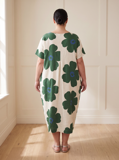 Lilia floral cocoon midi dress in green, back view, worn by a plus-size model