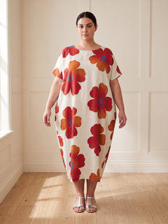 Lilia floral cocoon midi dress in red, front view, worn by a plus-size model