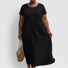 Tera openwork linen midi dress in black on a plus-size model