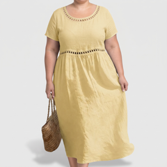 Tera openwork linen midi dress in yellow on a plus-size model