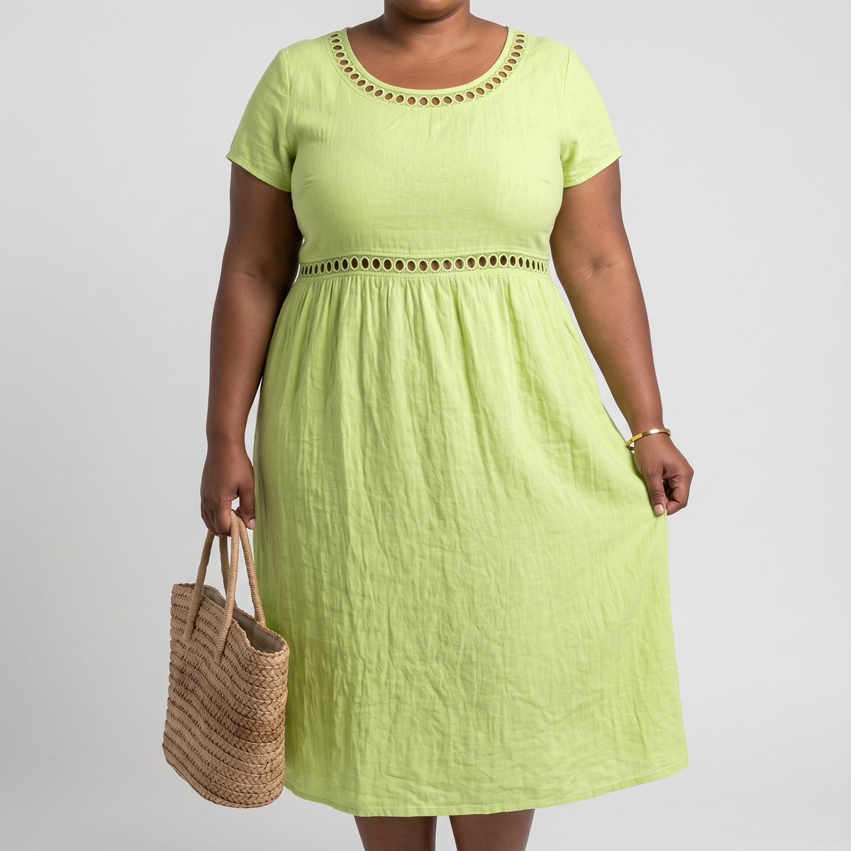 Tera openwork linen midi dress in green on a plus-size model