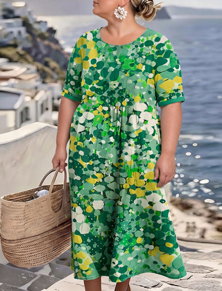 Elena painted floral midi dress in green on a plus-size model