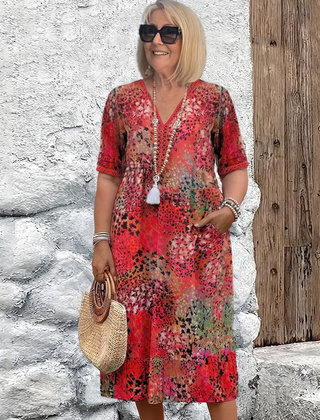 Susan dappled print midi dress in red on a plus-size model