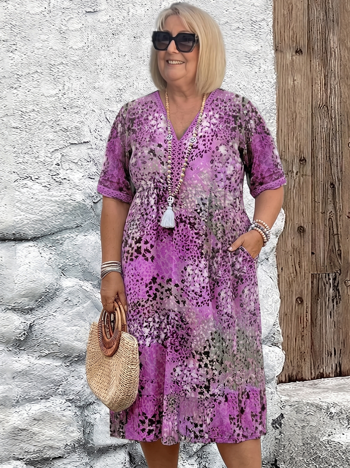 Susan dappled print midi dress in purple on a plus-size model