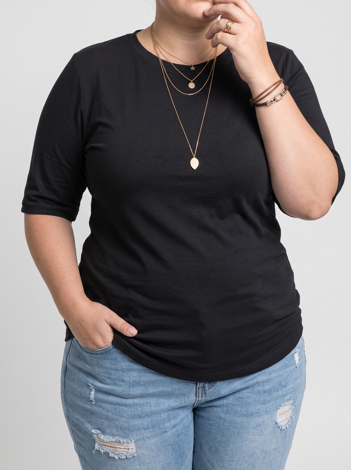 Harper half-sleeve crew neck tee in black on a plus-size model
