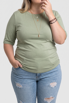 Harper half-sleeve crew neck tee in green on a plus-size model