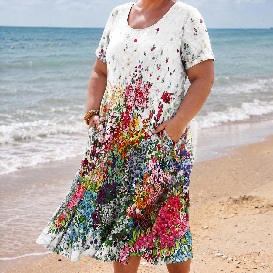 Maria floral pocket dress in white on the beach