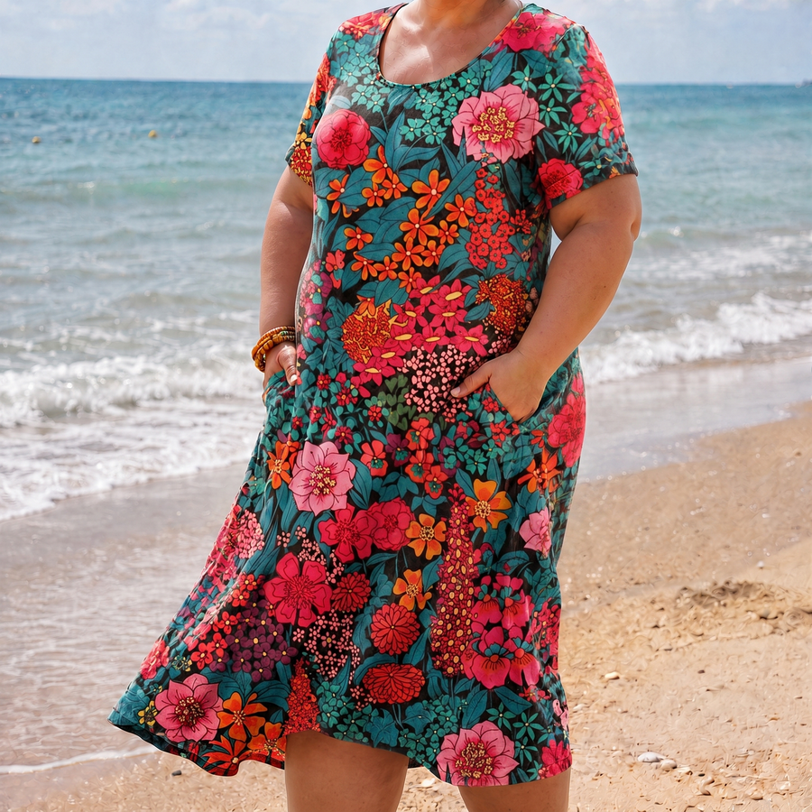 Olivia red floral pocket dress on the beach