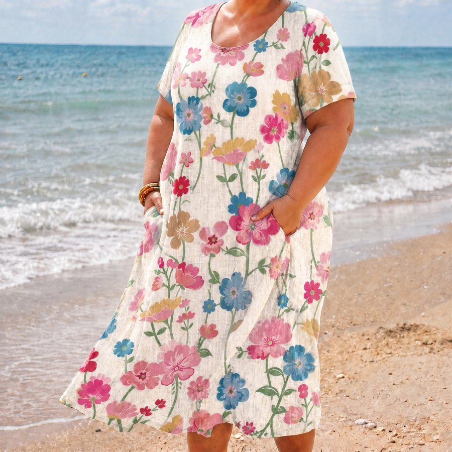 Quinn beige floral pocket dress on the beach