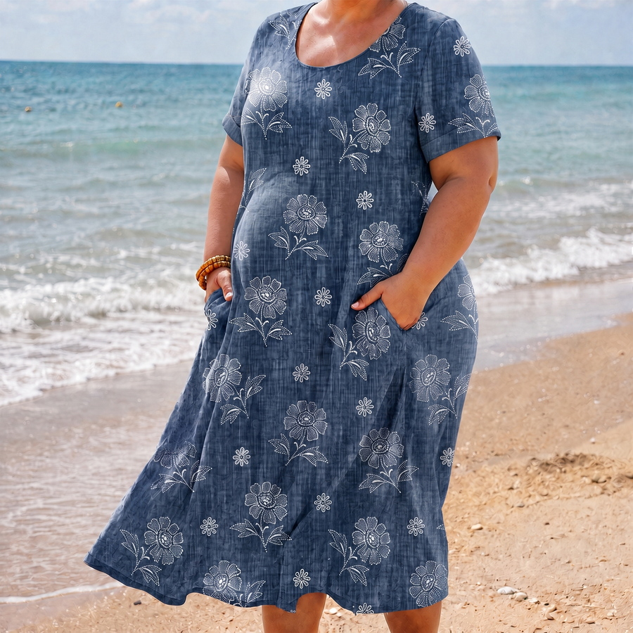 Piper blue floral pocket dress on the beach