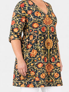 Lilian long blouse side view on a plus-size model