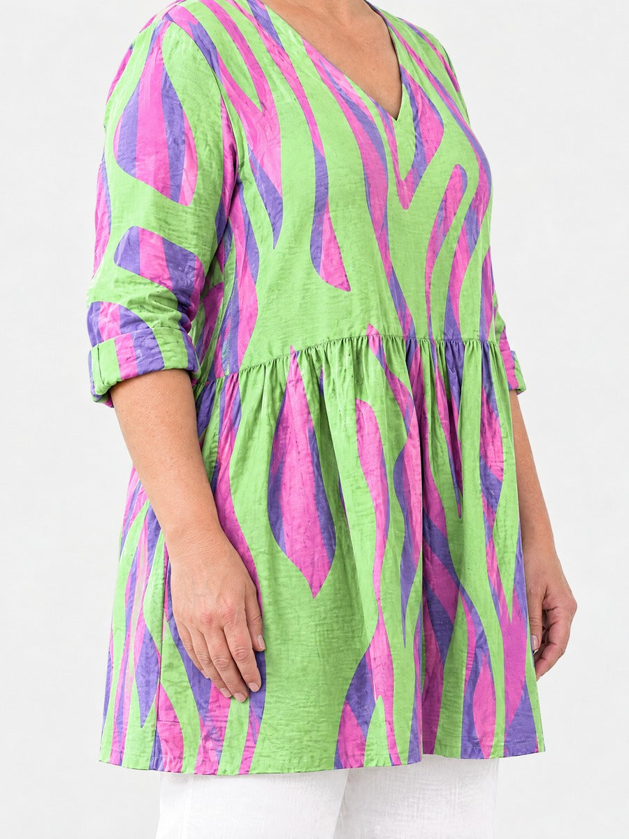 Lyla long blouse side view on a plus-size model