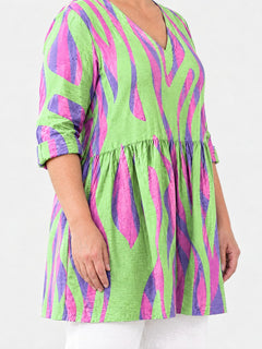 Lyla long blouse side view on a plus-size model