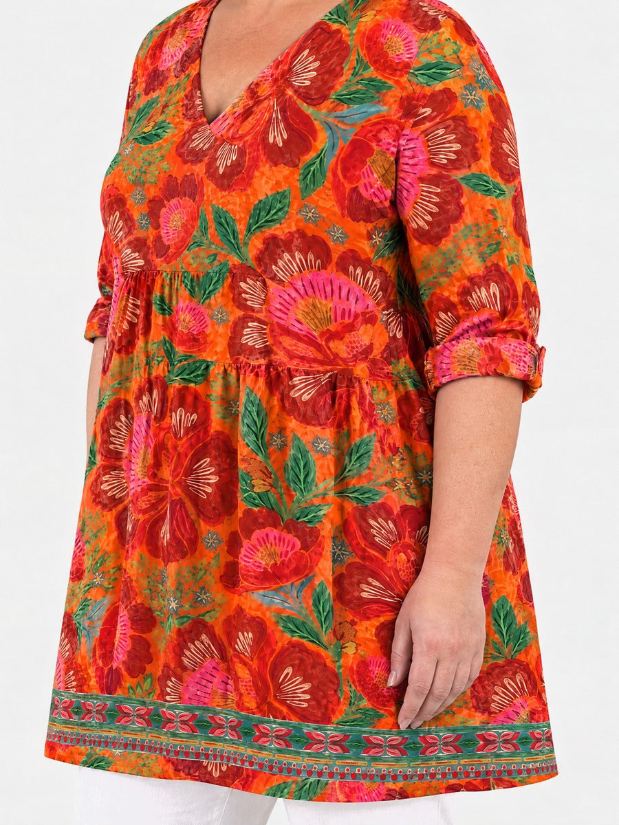 Priscilla long blouse side view on a plus-size model