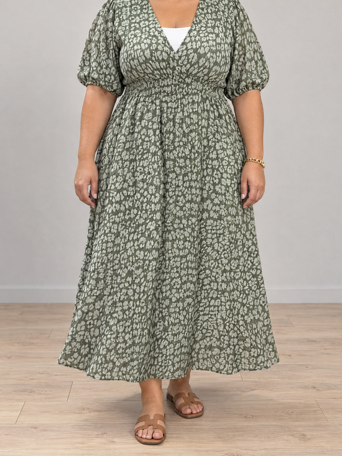 Sophia V-neck print maxi dress in green on a plus-size model